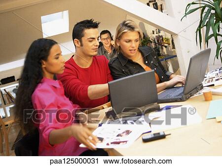 People working with laptops in office, close-up View Large Photo Image Stock Image - People working with laptops in office, close-up. Fotosearch