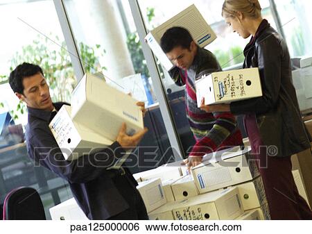 Two men and woman carrying boxes View Large Photo Image Stock Photograph - Two men and woman carrying boxes. Fotosearch