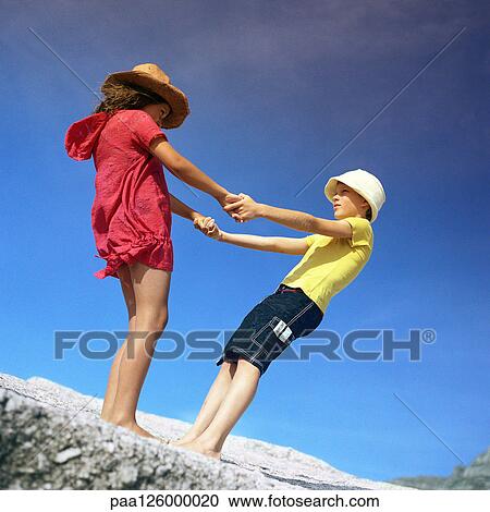 Children holding hands, outside View Large Photo Image Stock Image - Children holding hands, outside. Fotosearch