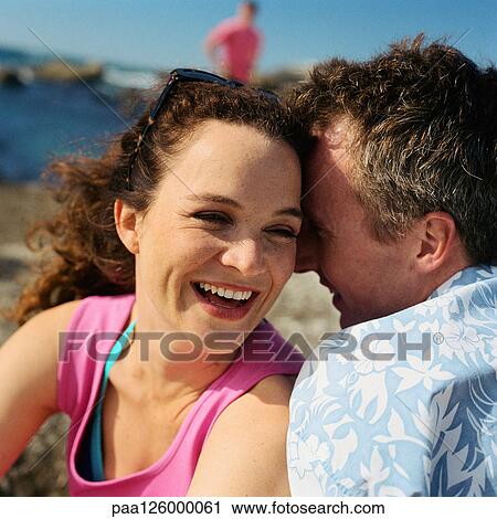 Couple together on beach, close-up View Large Photo Image Stock Image - Couple together on beach, close-up. Fotosearch