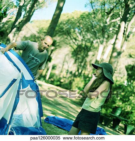 Man holding tent, girl smiling View Large Photo Image Stock Photography - Man holding tent, girl smiling. Fotosearch