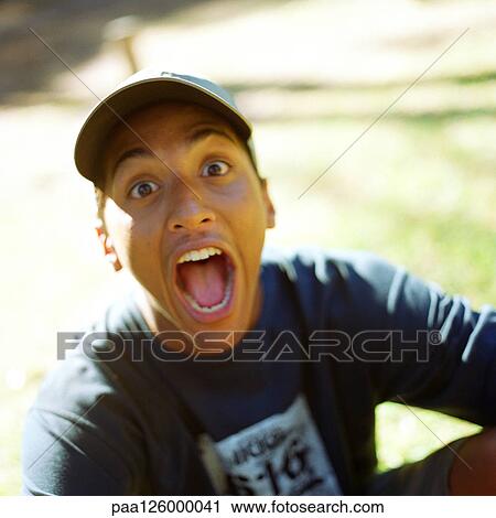Teenage boy opening mouth, portrait View Large Photo Image Stock Image - Teenage boy opening mouth, portrait. Fotosearch