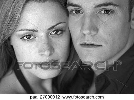 Stock Image - Couple cheek to cheek, close-up, b&w. Fotosearch
