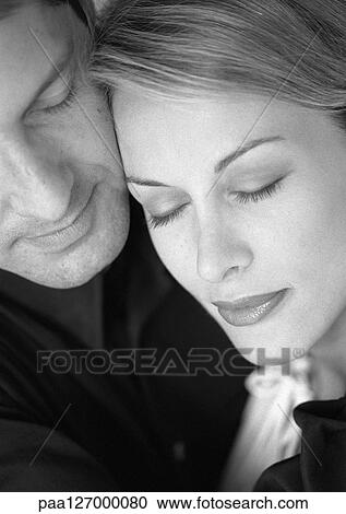 Stock Image - Couple, eyes closed, close-up, b&w. Fotosearch