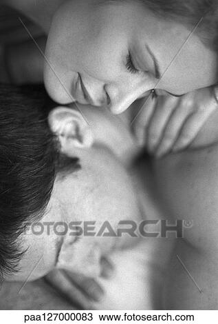 Couple lying down, close-up, b&w View Large Photo Image Stock Image - Couple lying down, close-up, b&w. Fotosearch