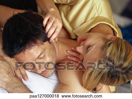 Stock Photo - Couple lying down. Fotosearch