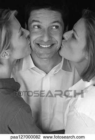 Man being kissed by two women, portrait, b&w View Large Photo Image Stock Image - Man being kissed by two women, portrait, b&w. Fotosearch