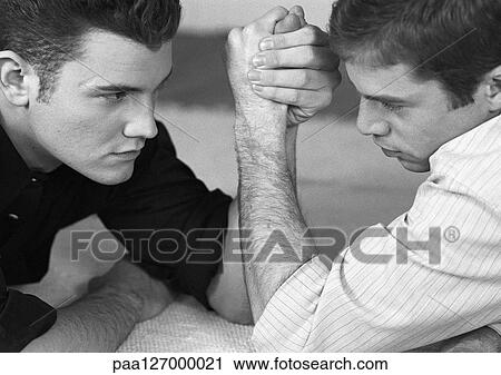 Two men arm wrestling, close-up, b&w View Large Photo Image Stock Image - Two men arm wrestling, close-up, b&w. Fotosearch