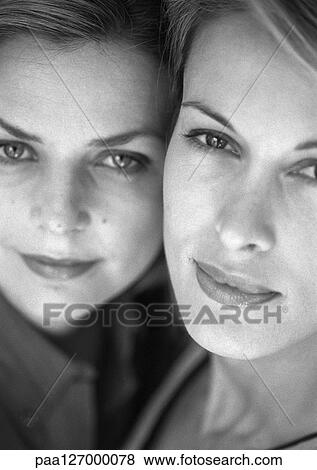 Two women cheek to cheek, close-up, b&w View Large Photo Image Stock Photo - Two women cheek to cheek, close-up, b&w. Fotosearch