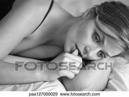Woman lying down, close-up, b&w View Large Photo Image Stock Photo - Woman lying down, close-up, b&w. Fotosearch