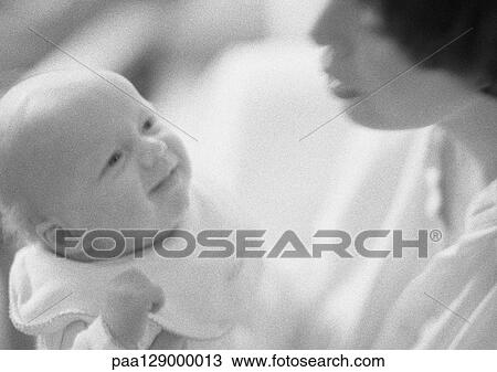 Infant looking up at mother, b&w View Large Photo Image Stock Image - Infant looking up at mother, b&w. Fotosearch