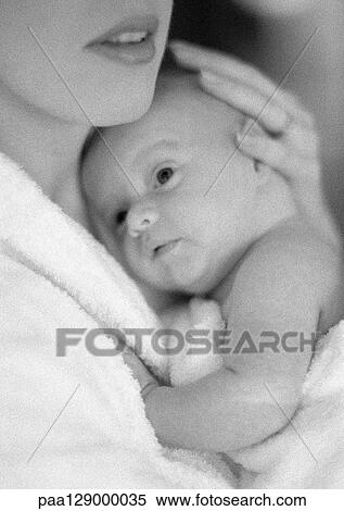 Mother holding infant, b&w View Large Photo Image Stock Photography - Mother holding infant, b&w. Fotosearch