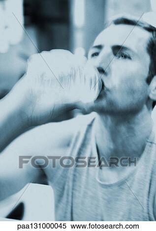Man drinking from bottle of water View Large Photo Image Stock Photography - Man drinking from bottle of water. Fotosearch