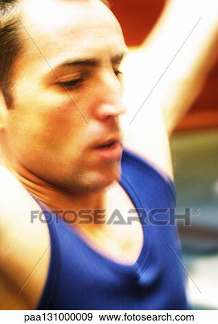 Stock Photo - Man exercising, close-up. Fotosearch