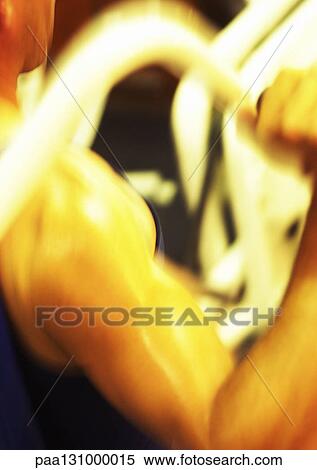 Man lifting weights, close-up View Large Photo Image Stock Photography - Man lifting weights, close-up. Fotosearch