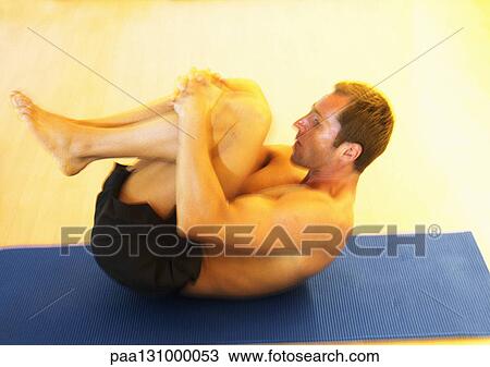 Man stretching on mat View Large Photo Image Stock Image - Man stretching on mat. Fotosearch