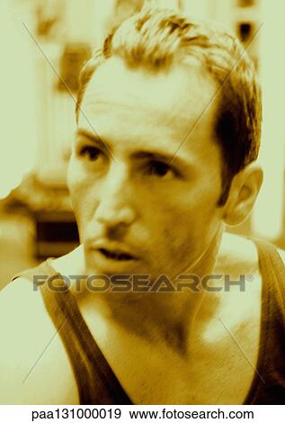 Man wearing tank top, close-up View Large Photo Image Stock Photo - Man wearing tank top, close-up. Fotosearch