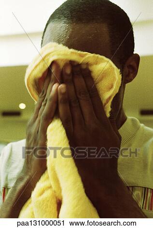 Man wiping off face with towel, close-up View Large Photo Image Stock Image - Man wiping off face with towel, close-up. Fotosearch