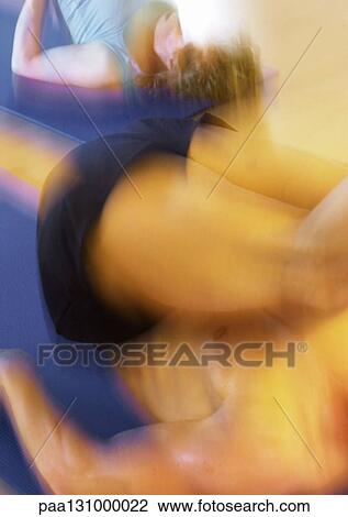 Woman and man stretching, blurred motion View Large Photo Image Stock Image - Woman and man stretching, blurred motion. Fotosearch