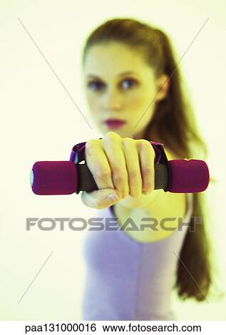 Woman lifting weights View Large Photo Image Stock Photograph - Woman lifting weights. Fotosearch