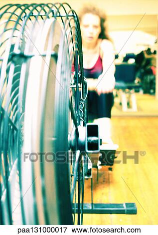 Woman using rowing machine in gym View Large Photo Image Stock Photo - Woman using rowing machine in gym. Fotosearch