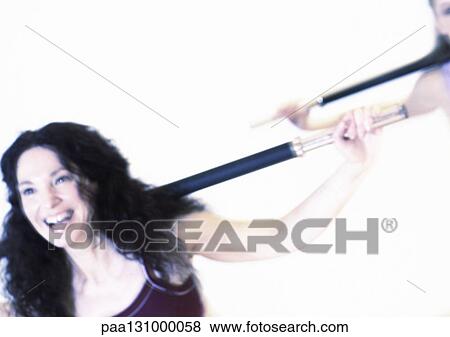 Women exercising with bars, head and shoulders View Large Photo Image Stock Photo - Women exercising with bars, head and shoulders. Fotosearch