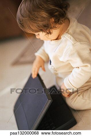 Baby with laptop, portrait. View Large Photo Image Stock Photo - Baby with laptop, portrait.. Fotosearch