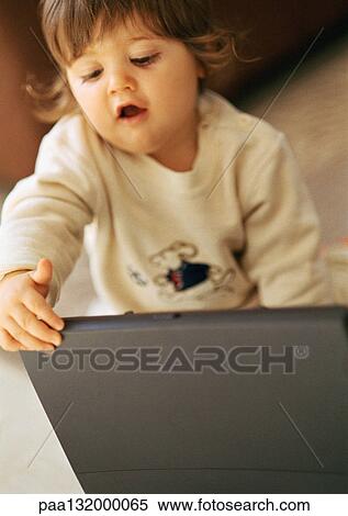 Baby with laptop, portrait. View Large Photo Image Stock Photography - Baby with laptop, portrait.. Fotosearch