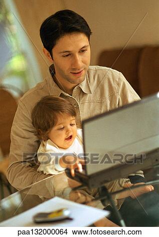 Father and baby using laptop. View Large Photo Image Picture - Father and baby using laptop.. Fotosearch