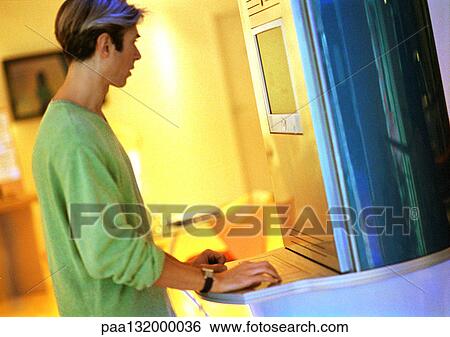 Man using computer, side view. View Large Photo Image Stock Photograph - Man using computer, side view.. Fotosearch