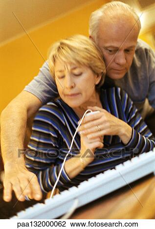 Mature couple, man pressing key on keyboard, woman holding computer mouse. View Large Photo Image Stock Image - Mature couple, man pressing key on keyboard, woman holding computer mouse.. Fotosearch