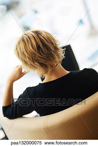 Woman sitting, using laptop, rear view. View Large Photo Image Stock Photography - Woman sitting, using laptop, rear view.. Fotosearch