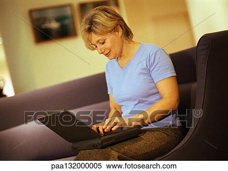 Woman using laptop. View Large Photo Image Stock Photography - Woman using laptop.. Fotosearch