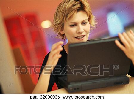 Young woman using laptop. View Large Photo Image Stock Photography - Young woman using laptop.. Fotosearch