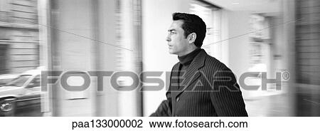 Businessman in office, b&w, panoramic view View Large Photo Image Stock Image - Businessman in office, b&w, panoramic view. Fotosearch
