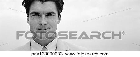 Businessman looking at camera, close-up, b&w, panoramic view View Large Photo Image Stock Image - Businessman looking at camera, close-up, b&w, panoramic view. Fotosearch
