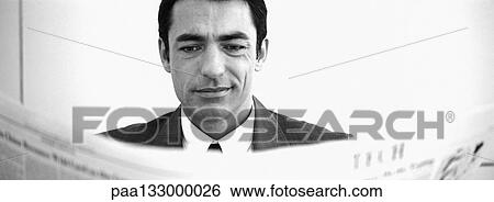 Man reading newspaper, b&w, panoramic view View Large Photo Image Stock Photograph - Man reading newspaper, b&w, panoramic view. Fotosearch