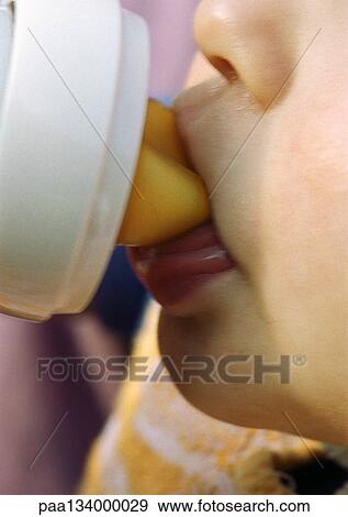 Baby drinking from bottle, close-up on mouth. View Large Photo Image Stock Photo - Baby drinking from bottle, close-up on mouth.. Fotosearch