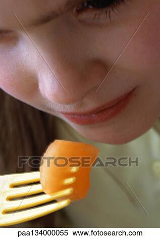 Stock Photography - Child eating, close-up.. Fotosearch