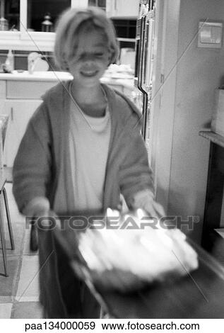 Child in front of cake and candles, blurred motion, b&w. View Large Photo Image Stock Photo - Child in front of cake and candles, blurred motion, b&w.. Fotosearch