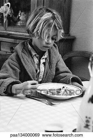 Child sitting with plate, portrait, b&w. View Large Photo Image Stock Photo - Child sitting with plate, portrait, b&w.. Fotosearch