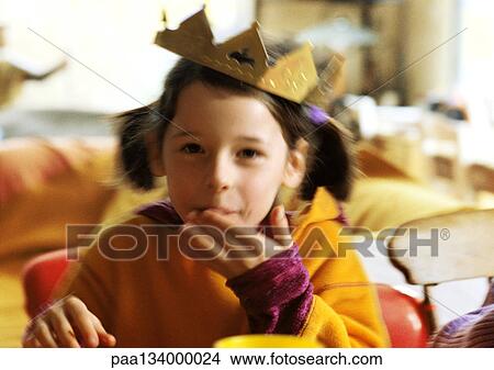Child with paper crown on head, portrait. View Large Photo Image Picture - Child with paper crown on head, portrait.. Fotosearch