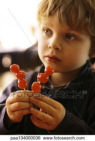 Little boy with cherries on sticks, portrait. View Large Photo Image Stock Photograph - Little boy with cherries on sticks, portrait.. Fotosearch