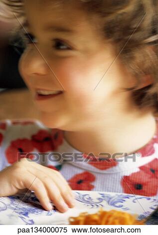 Stock Photography - Little girl smiling, portrait.. Fotosearch
