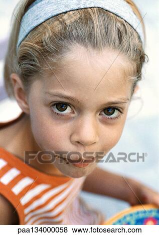 Little girl with chocolate on face, looking into camera, portrait. View Large Photo Image Stock Photo - Little girl with chocolate on face, looking into camera, portrait.. Fotosearch