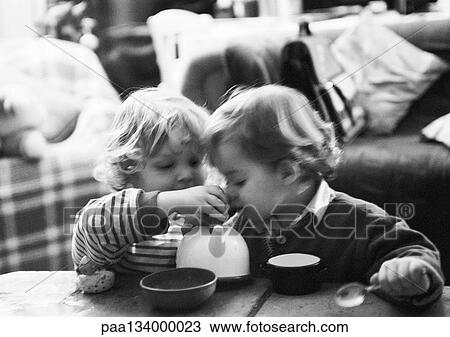 Two children having tea party, b&w. View Large Photo Image Stock Image - Two children having tea party, b&w.. Fotosearch