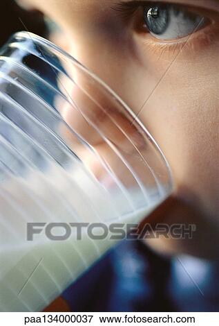 Stock Photo - Young child drinking milk, close-up.. Fotosearch