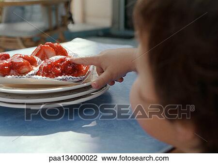 Young child with finger on cake, focus on hand. View Large Photo Image Stock Image - Young child with finger on cake, focus on hand.. Fotosearch