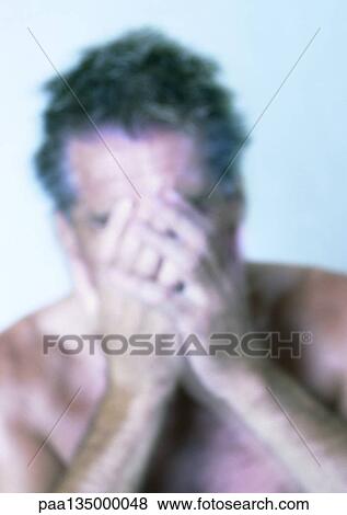 Mature man covering face with hands, close-up, portrait, blurred View Large Photo Image Stock Photo - Mature man covering face with hands, close-up, portrait, blurred. Fotosearch