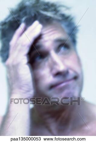 Mature man with hand on head, close-up, portrait View Large Photo Image Stock Image - Mature man with hand on head, close-up, portrait. Fotosearch